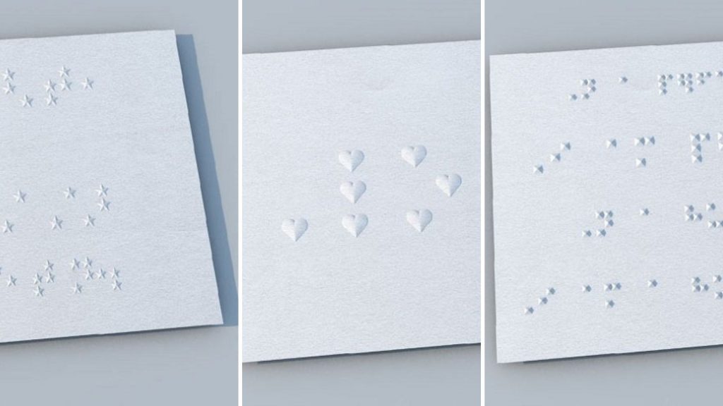 fotos de placas em braille com símbolos de estrela, coração e pirâmides. As placas são brancas e os simbolos também. 
